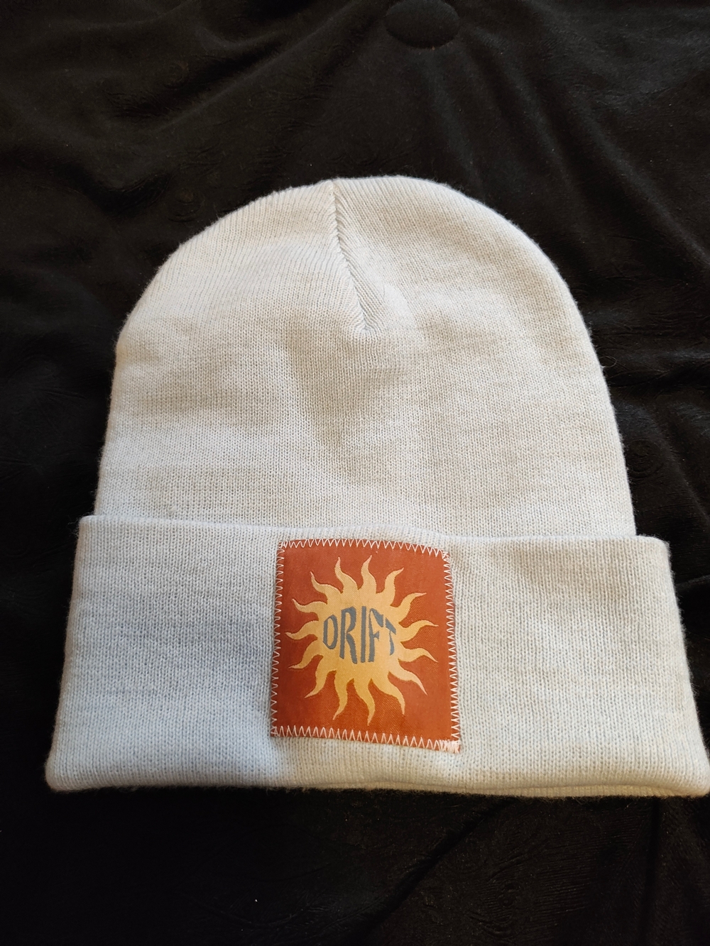 Orift Cream Beanie Hat with Sun Patch